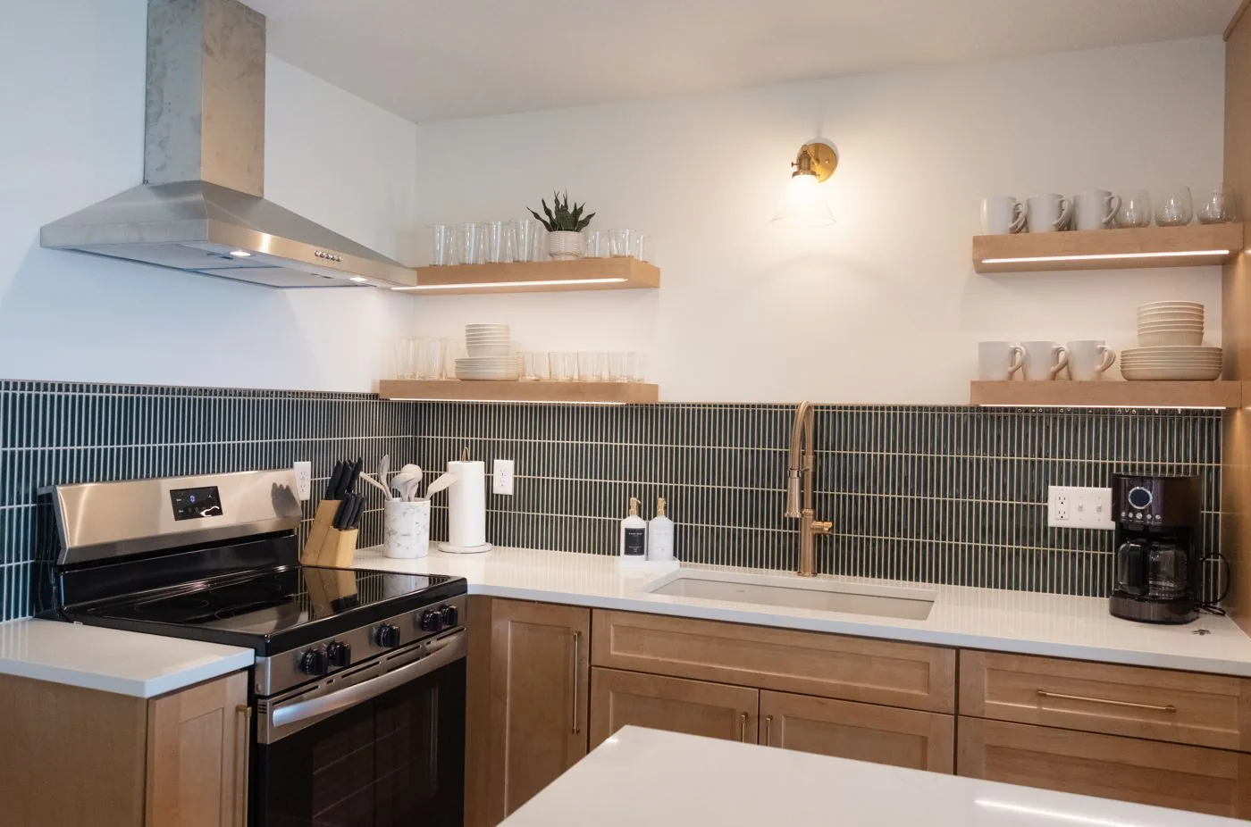 Kitchen with green tile backsplash