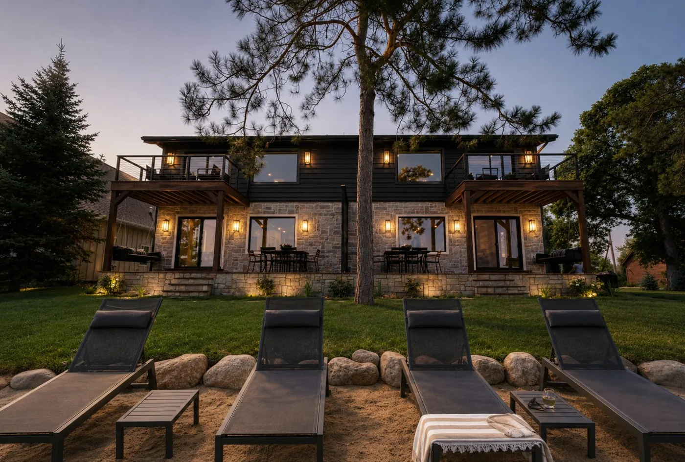 The villas lit up at dusk above the beach