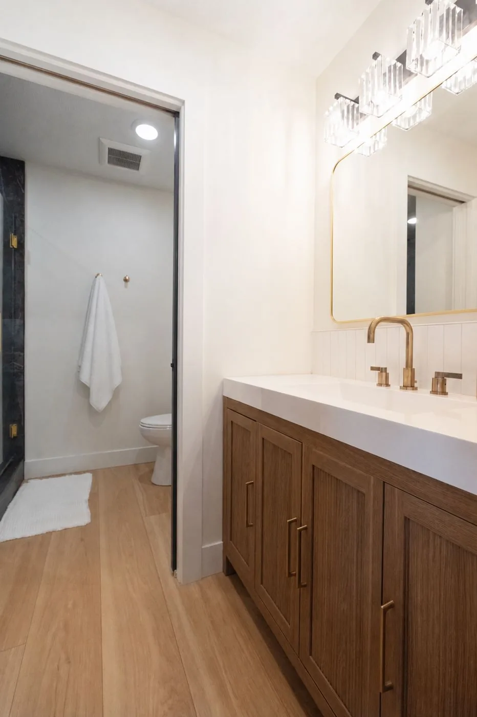 Full bathroom with wood vanity and walk-in shower